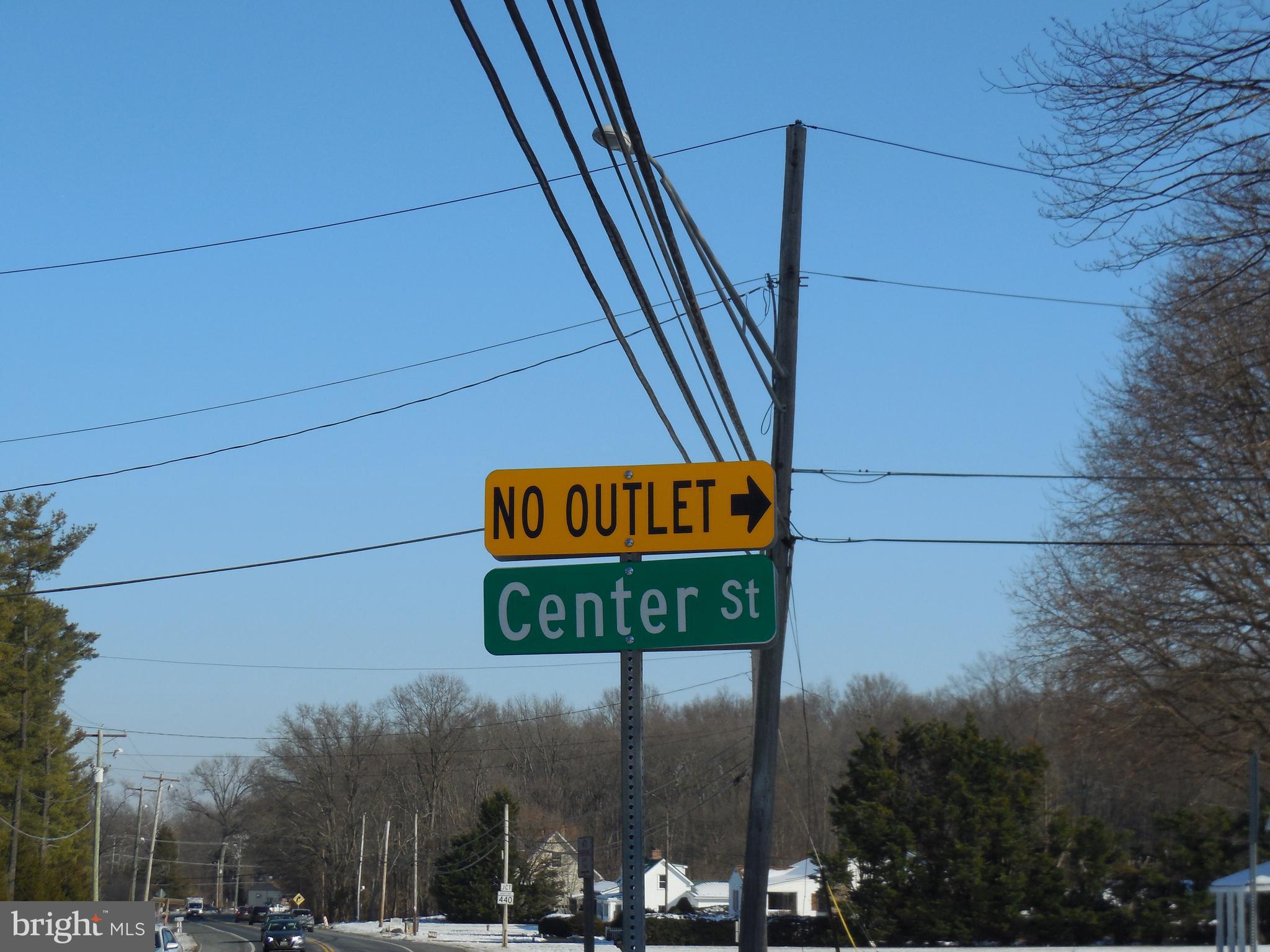 4041 Conowingo Road, Unit 14 Darlington, MD 21034 - Photo 25 of 27 a sign on street next to brick wall