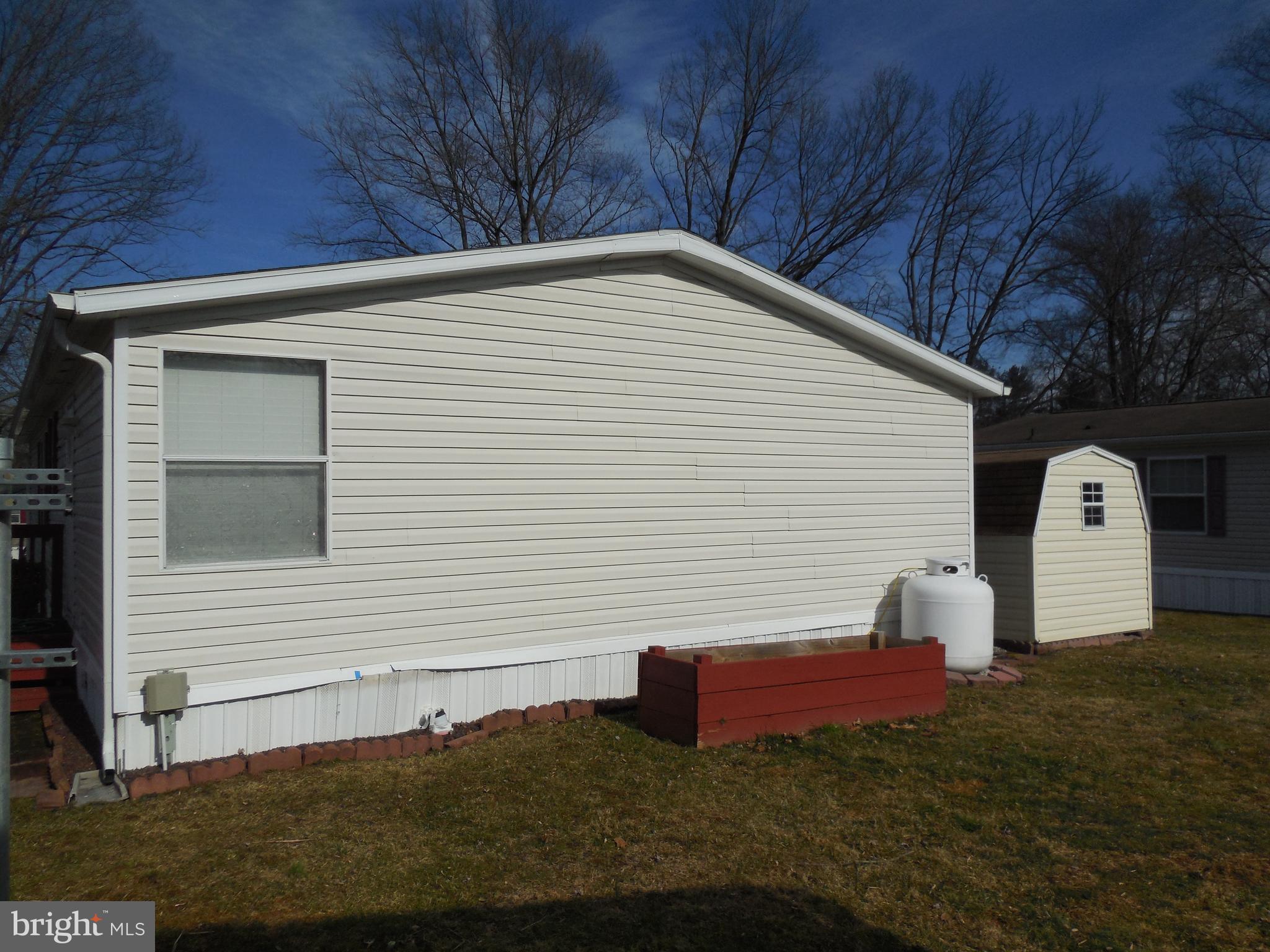 4041 Conowingo Road, Unit 14 Darlington, MD 21034 - Photo 7 of 27 a view of a small house with yard