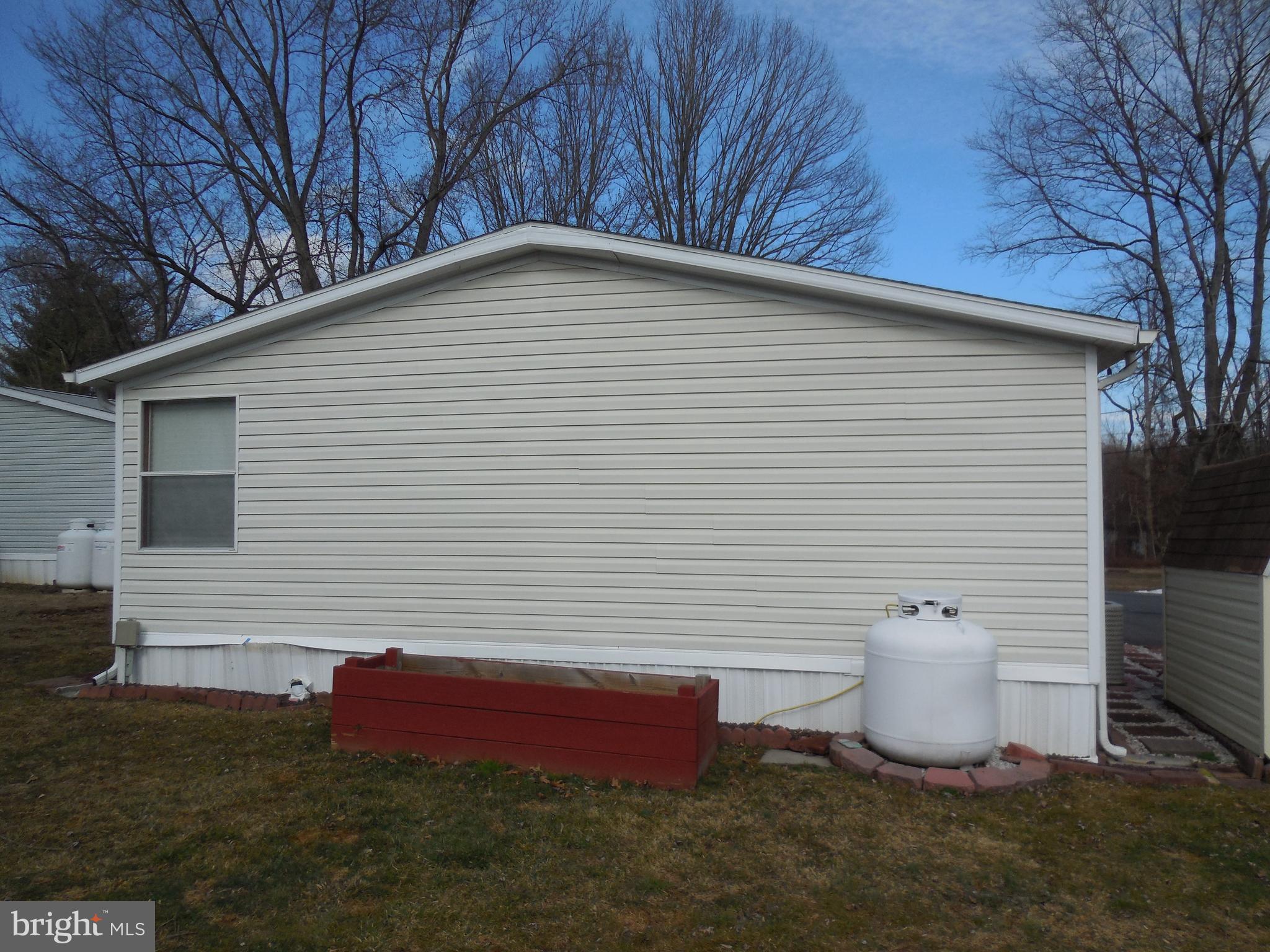 4041 Conowingo Road, Unit 14 Darlington, MD 21034 - Photo 8 of 27 a view of a backyard with sitting area