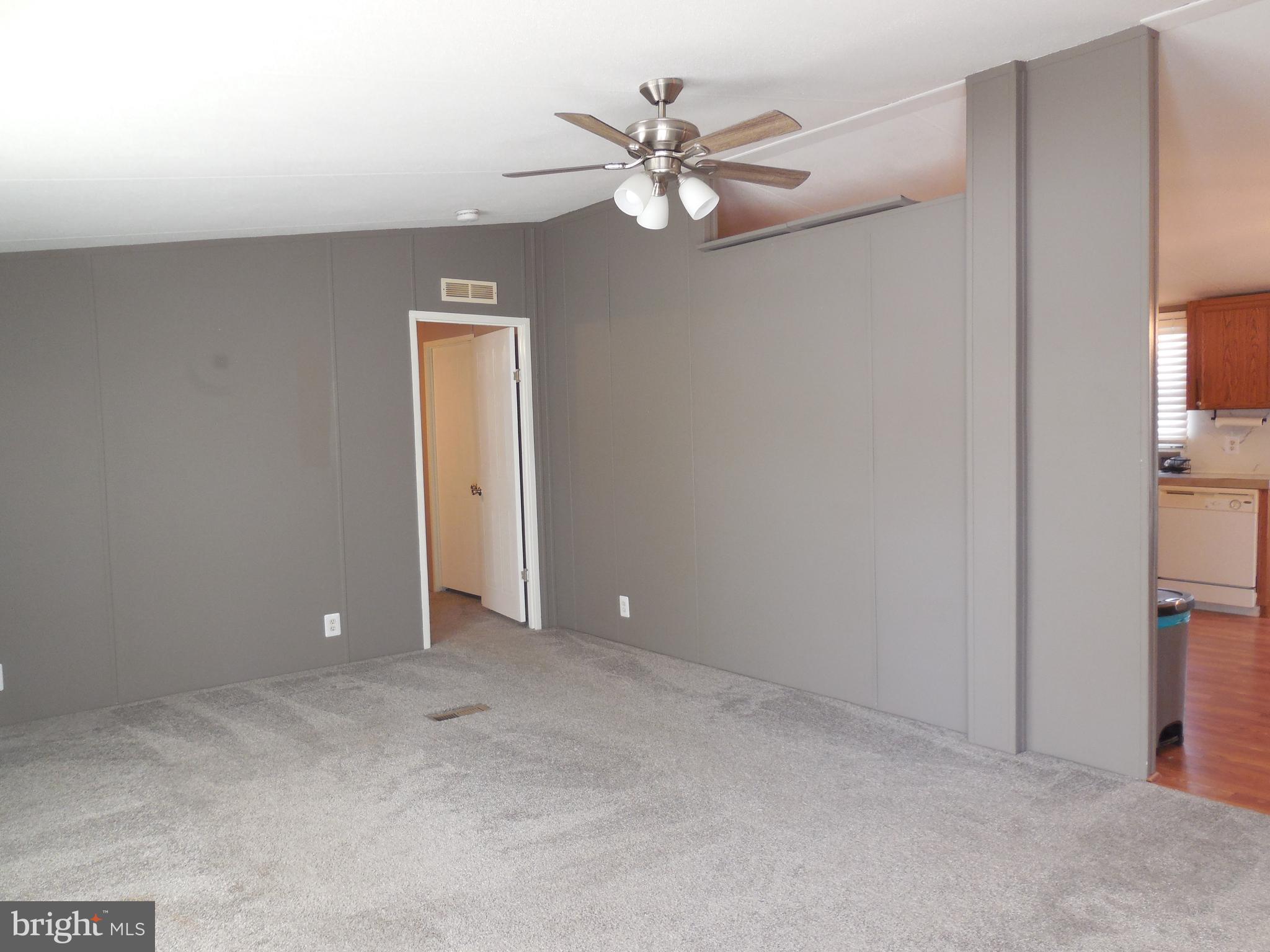 4041 Conowingo Road, Unit 14 Darlington, MD 21034 - Photo 10 of 27 a view of an empty room with a ceiling fan