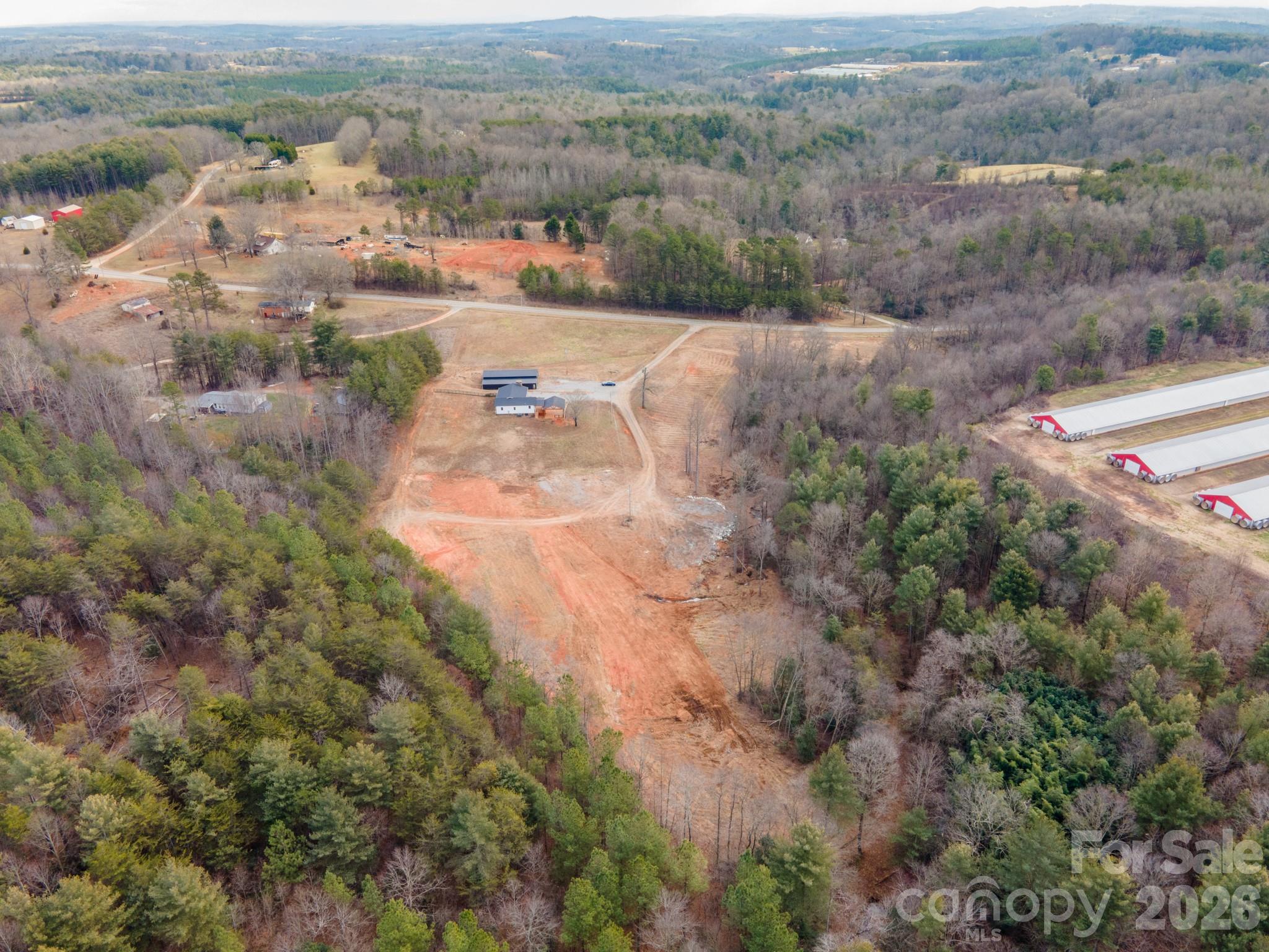 7400 Corn Hill Road Connelly Springs, NC 28612 - Photo 40 of 41 an aerial view of residential houses with outdoor space and trees