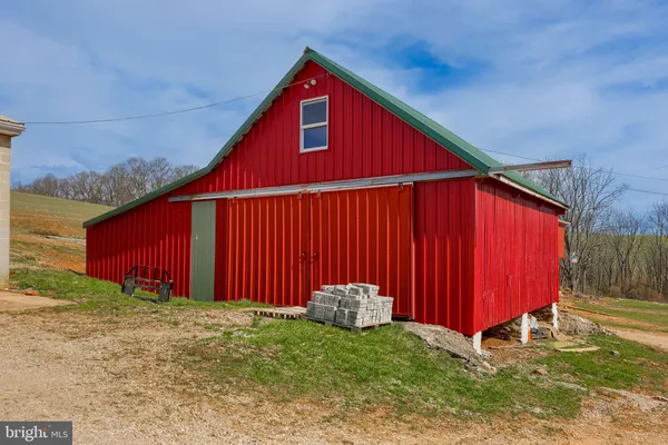 a view of a backyard with potted plants