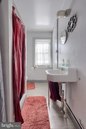 a bedroom with 2 bed and a couch