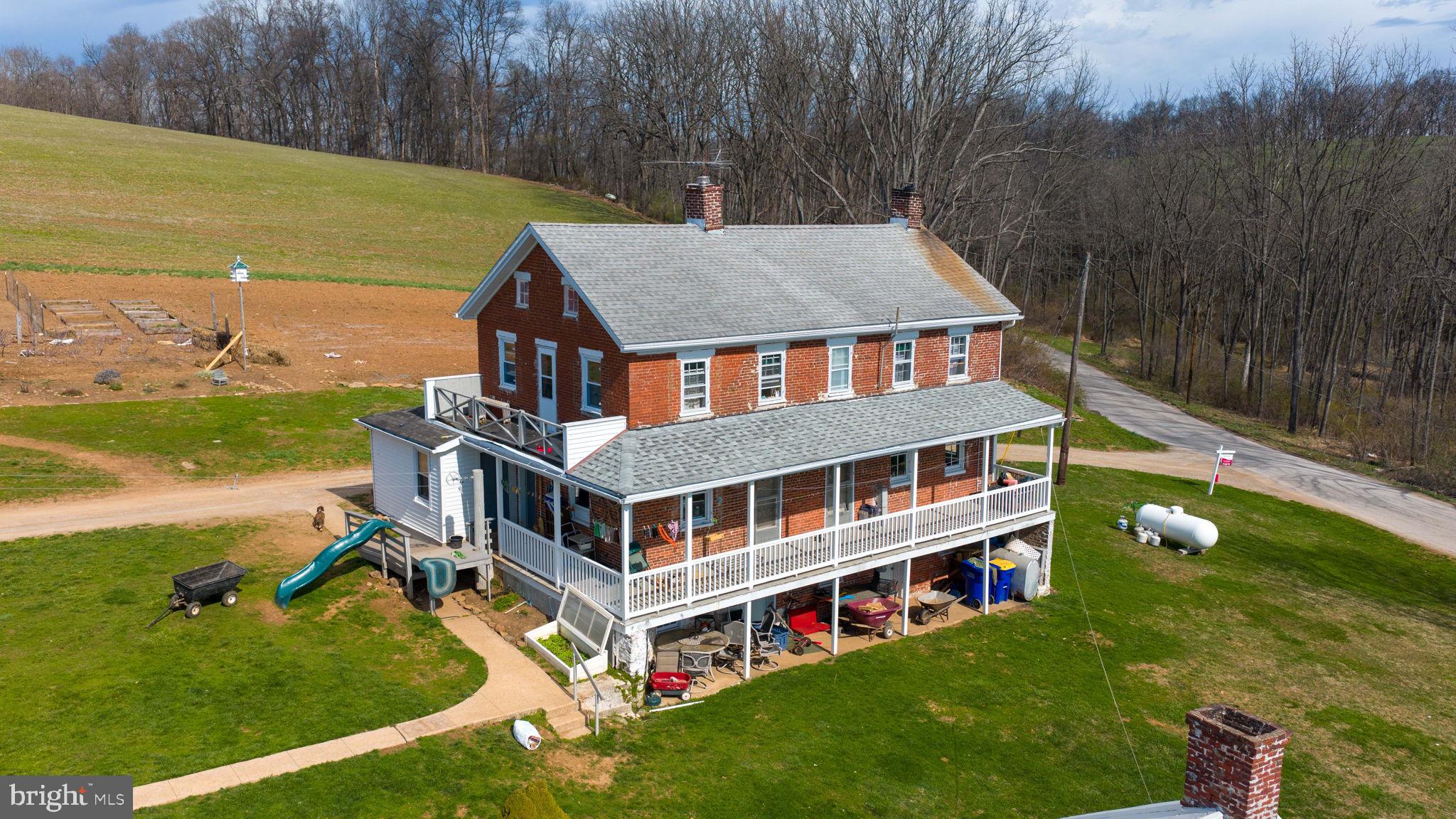 1001 Kirchner Road New Freedom, PA 17349 - Photo 6 of 37 a view of a house with pool and a yard