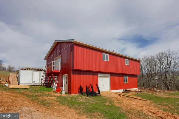 a front view of building with yard