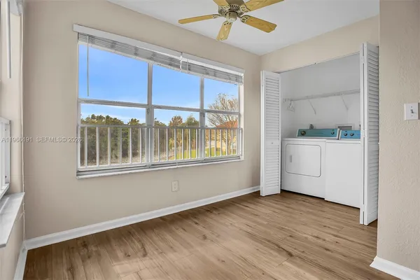 a view of an empty room with a window
