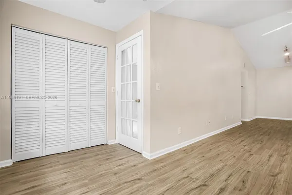 a backyard of apartments with large trees
