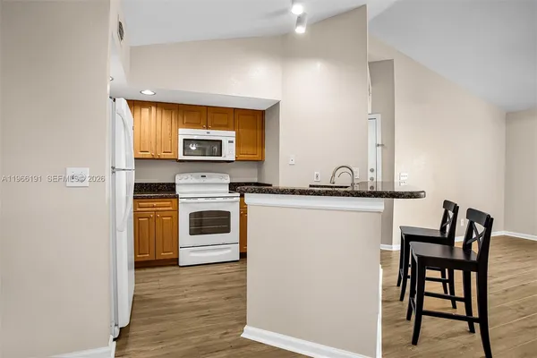 a kitchen with a stove and a microwave