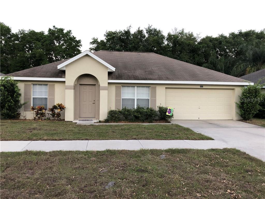 3850 Bayshore Circle Tavares, FL 32778 - Photo 1 of 1 a front view of a house with a yard
