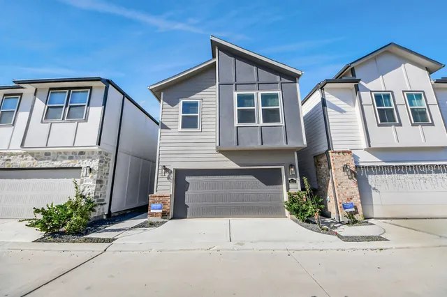 a front view of a house with garage