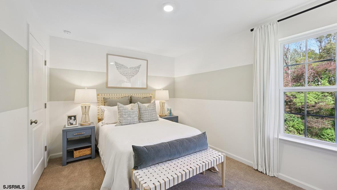 507 Scotty Boulevard, Unit 1301 Rio Grande, NJ 08242 - Photo 25 of 42 a bedroom with a bed and a window