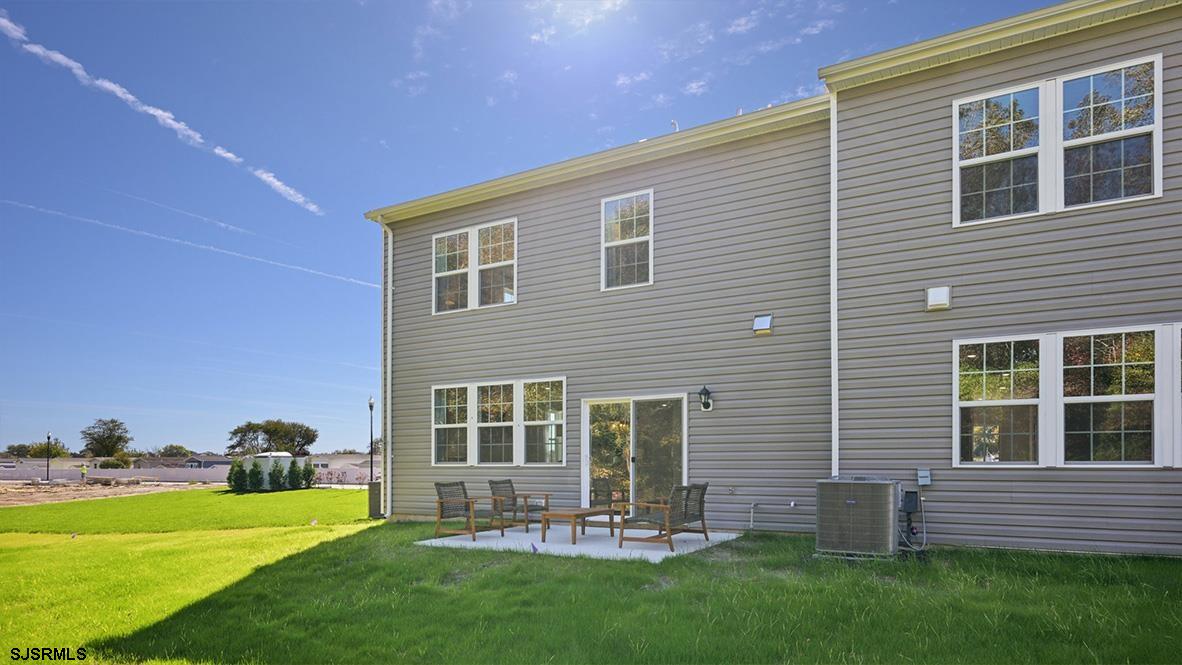 507 Scotty Boulevard, Unit 1301 Rio Grande, NJ 08242 - Photo 41 of 43 a front view of a house with a yard