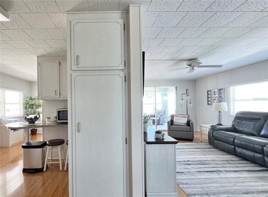 1100 South Belcher Road, Unit 270 Largo, FL 33771 - Photo 14 of 32 a living room with furniture and a wooden floor