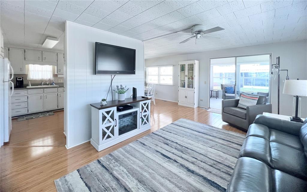 1100 South Belcher Road, Unit 270 Largo, FL 33771 - Photo 16 of 32 a living room with furniture and a flat screen tv