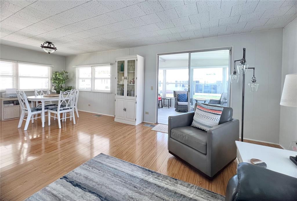 1100 South Belcher Road, Unit 270 Largo, FL 33771 - Photo 17 of 32 a living room with furniture wooden floor and a large window