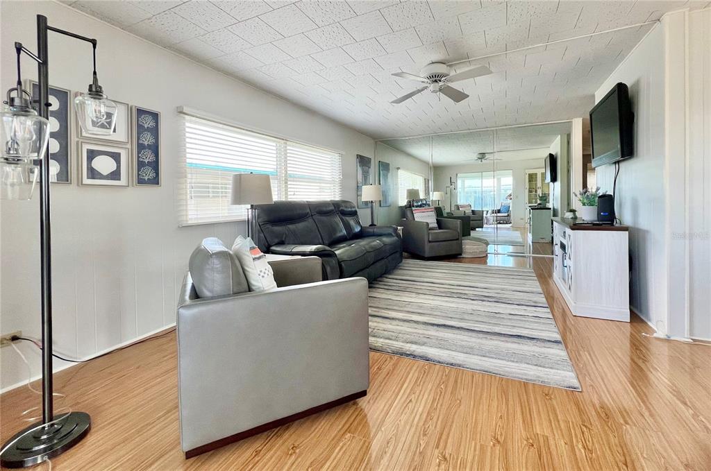 1100 South Belcher Road, Unit 270 Largo, FL 33771 - Photo 19 of 32 a living room with furniture and a flat screen tv