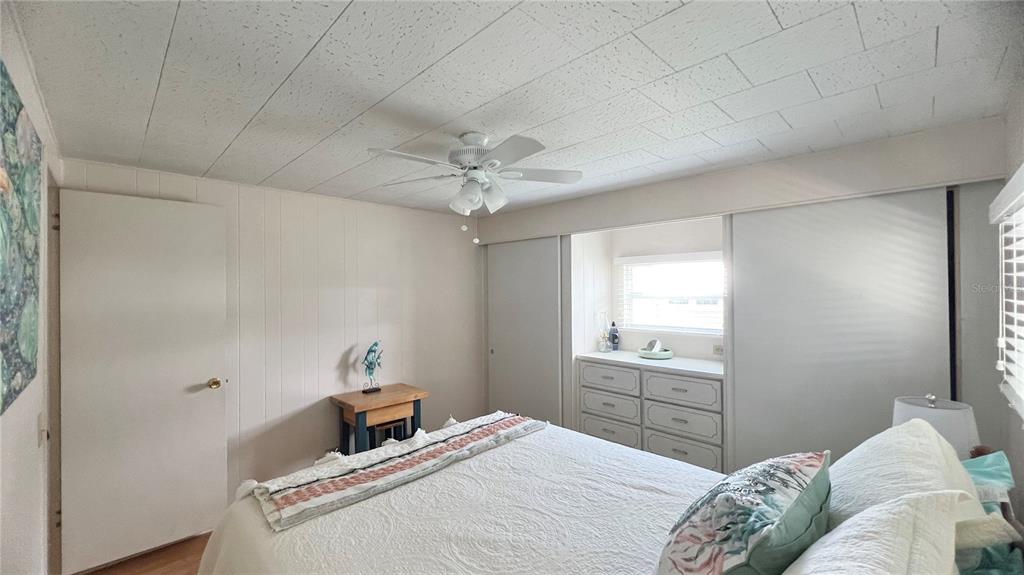 1100 South Belcher Road, Unit 270 Largo, FL 33771 - Photo 24 of 32 a bedroom with a bed and a window