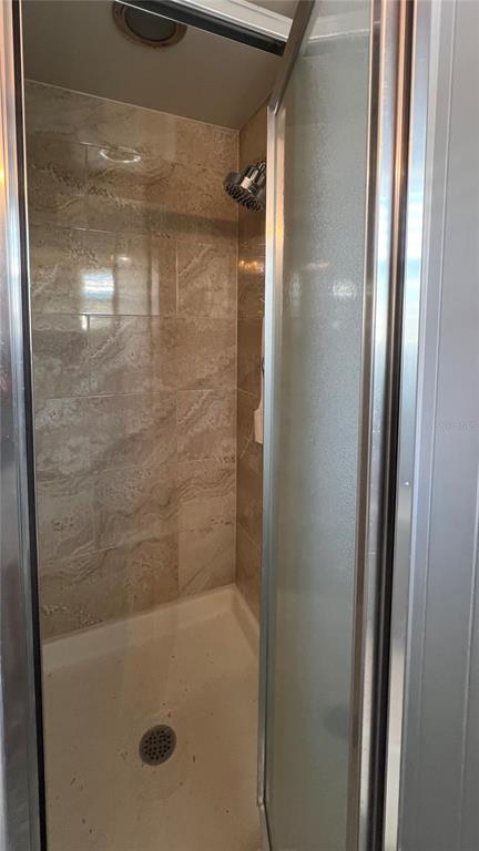 1100 South Belcher Road, Unit 270 Largo, FL 33771 - Photo 29 of 32 a bathroom with a glass shower door