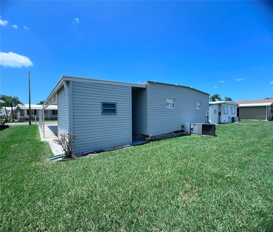 1100 South Belcher Road, Unit 270 Largo, FL 33771 - Photo 30 of 32 a view of a backyard with potted plants