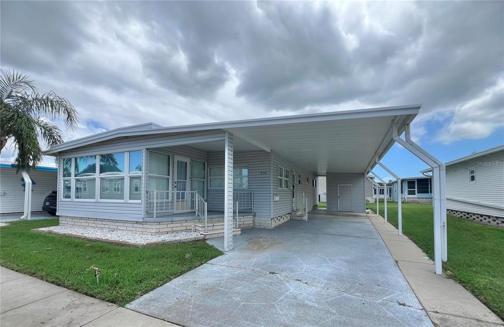 1100 South Belcher Road, Unit 270 Largo, FL 33771 - Photo 32 of 32 a view of a house with a yard