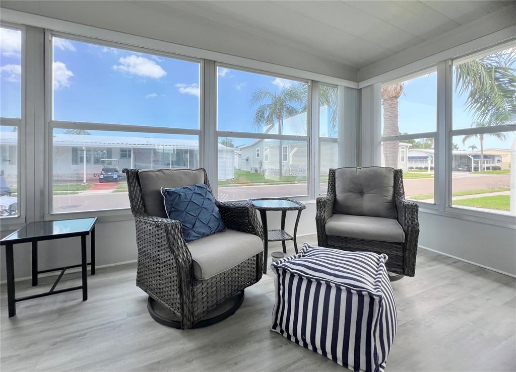 1100 South Belcher Road, Unit 270 Largo, FL 33771 - Photo 4 of 32 a living room with furniture and a large window