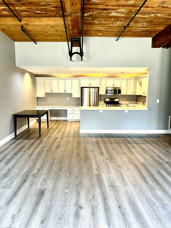 12 Brookside Road, Unit 3 Westford, MA 01886 - Photo 12 of 28 a view of a room with wooden floor