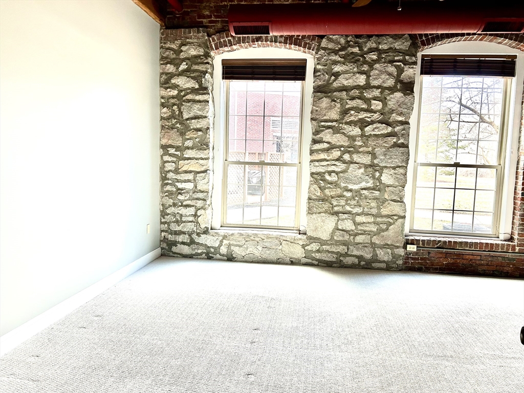 12 Brookside Road, Unit 3 Westford, MA 01886 - Photo 18 of 28 a view of an empty room with a window