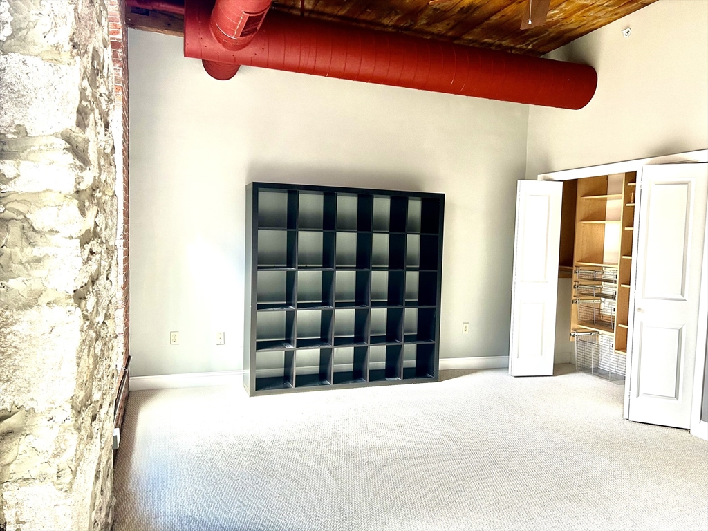 12 Brookside Road, Unit 3 Westford, MA 01886 - Photo 20 of 28 a view of a room with window and a table