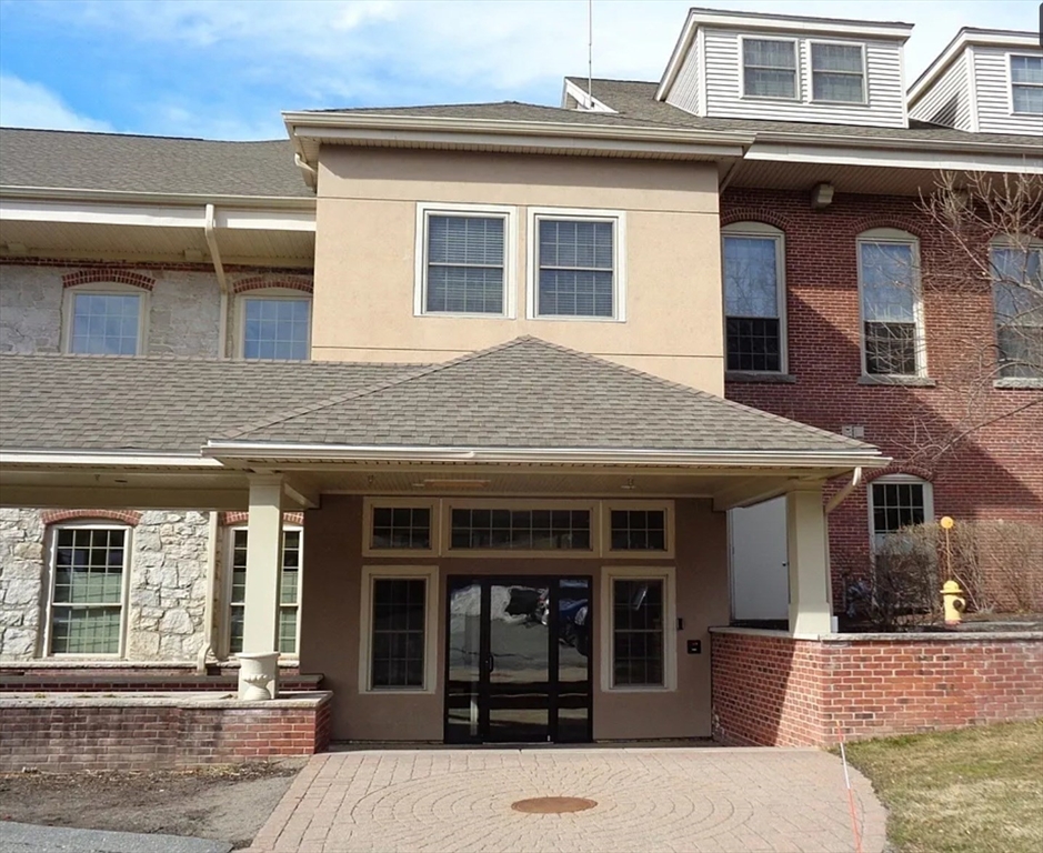12 Brookside Road, Unit 3 Westford, MA 01886 - Photo 2 of 28 front view of a house with a barbeque