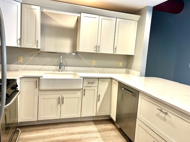 12 Brookside Road, Unit 3 Westford, MA 01886 - Photo 8 of 28 a kitchen with a sink cabinets and a window
