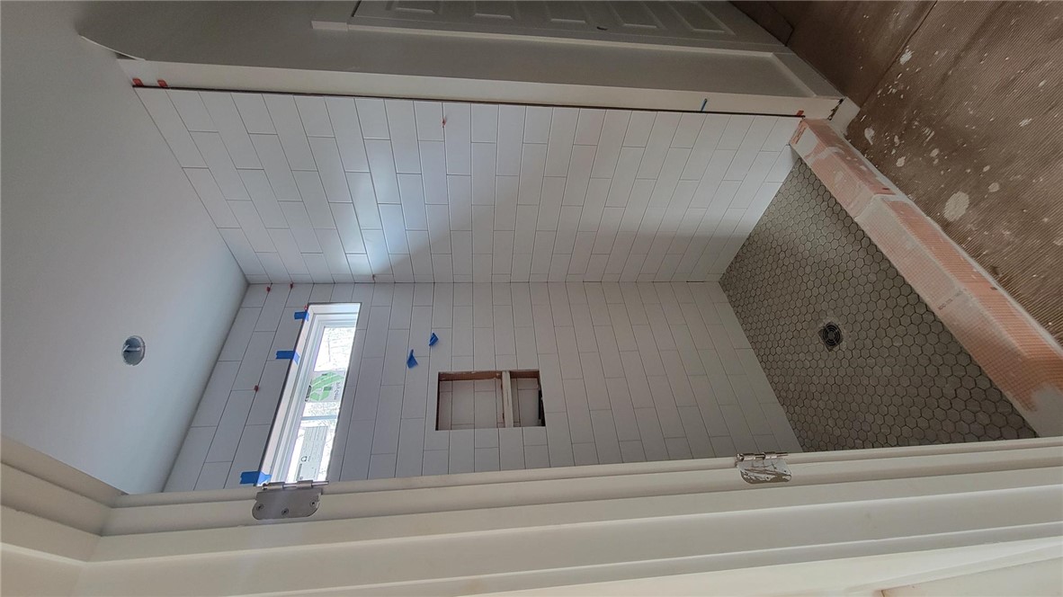 533 16th Circle Walhalla, SC 29691 - Photo 6 of 28 This shower features stylish subway tile walls and a classic hexagon tile floor.