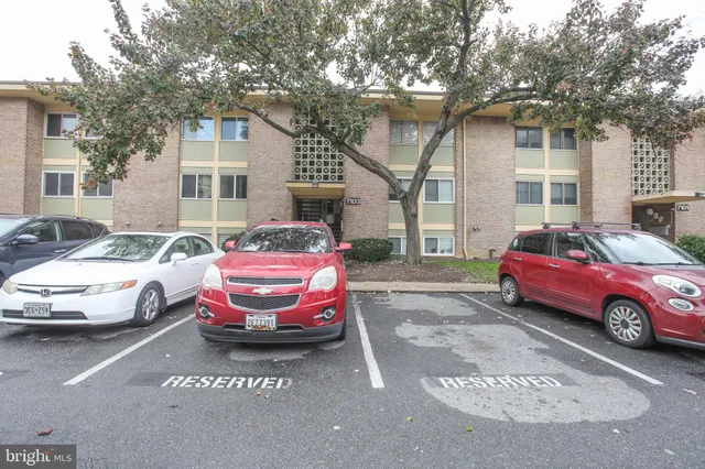 a front view of a house with parking space