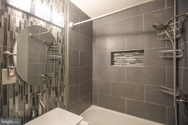 a bathroom with a toilet and shower