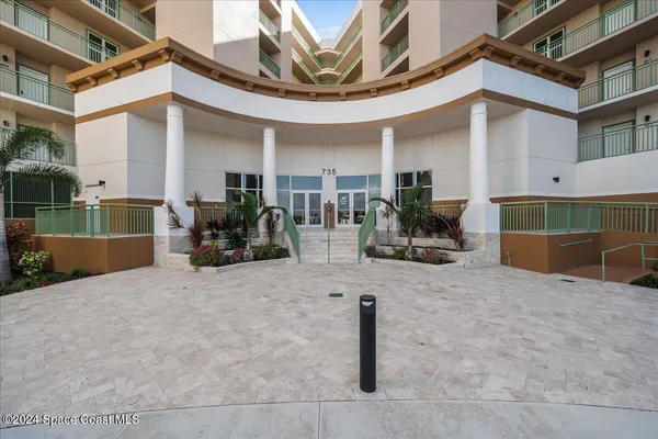 a view of a building with sitting area