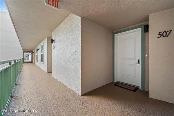 a view of a hallway with staircase