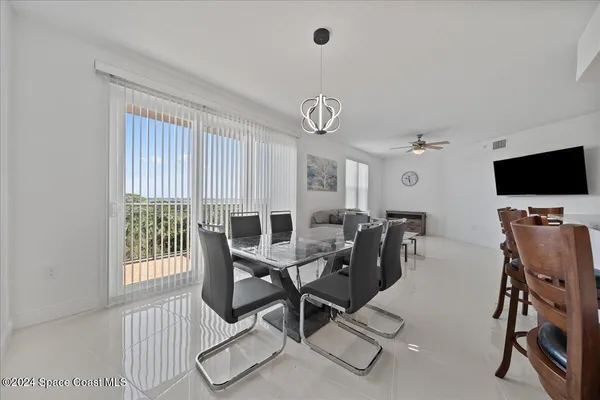 a view of a dining room with furniture window and outside view