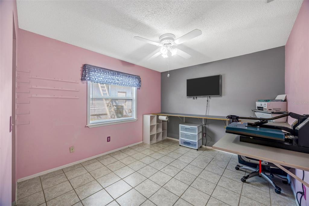 609 King Henry Court Seffner, FL 33584 - Photo 21 of 42 a bedroom with furniture and a window