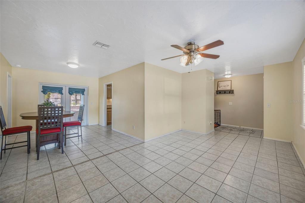 609 King Henry Court Seffner, FL 33584 - Photo 27 of 42 an empty room with furniture and a chandelier fan