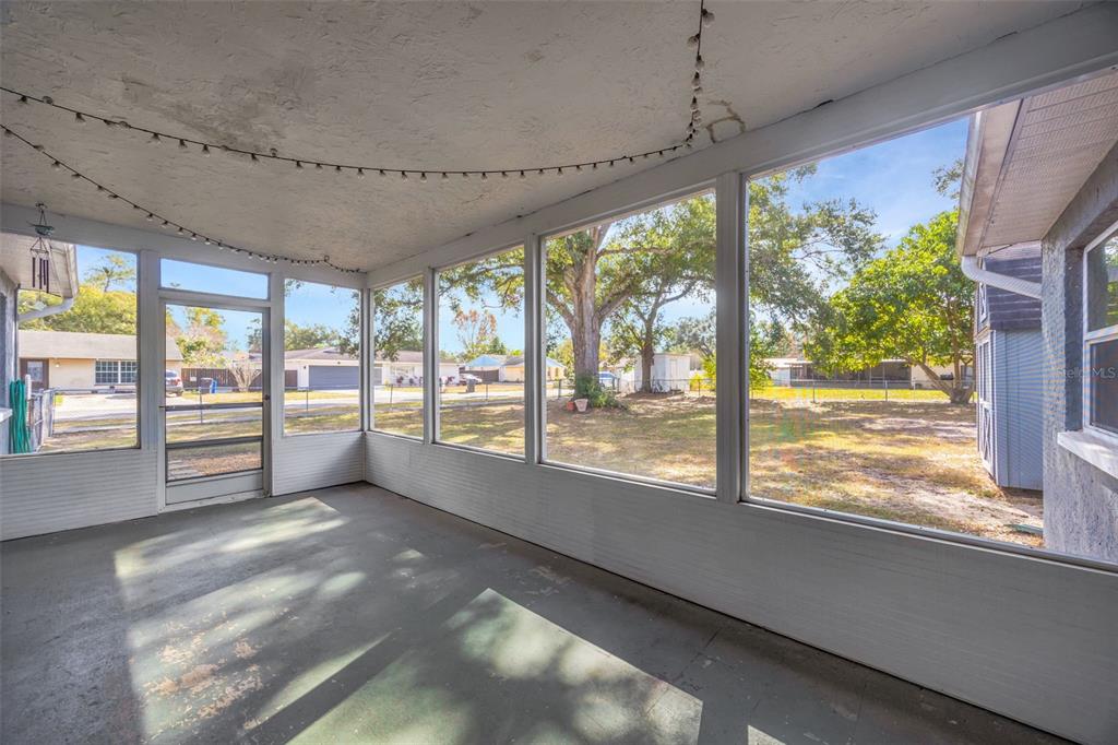 609 King Henry Court Seffner, FL 33584 - Photo 32 of 42 a view of an empty room with a fireplace and windows