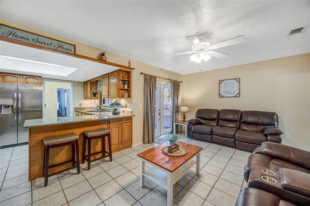 609 King Henry Court Seffner, FL 33584 - Photo 10 of 42 a living room with furniture and a dining table