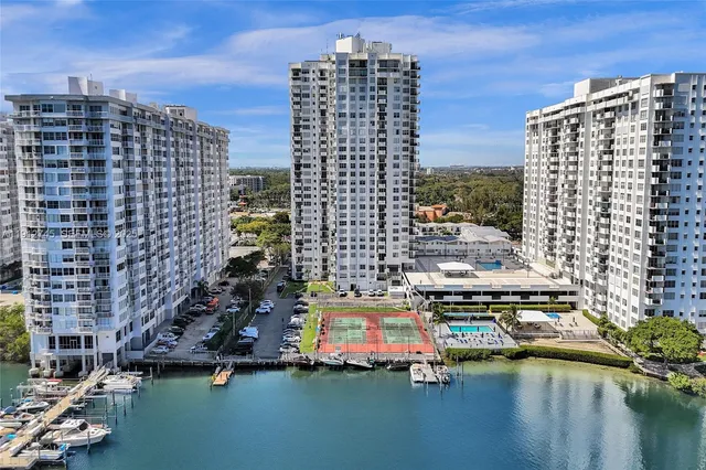 a view of tall buildings and a lake view
