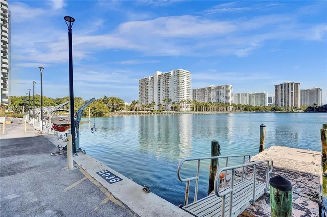 a view of a lake with tall buildings