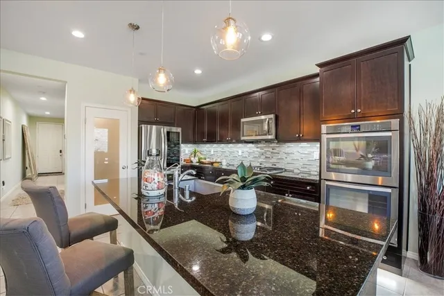 a living room with furniture or couch and a potted plant