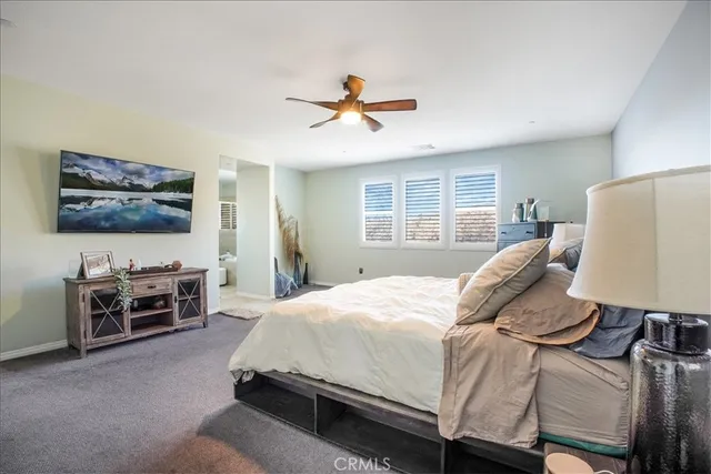 a bathroom with a granite countertop sink a mirror and shower