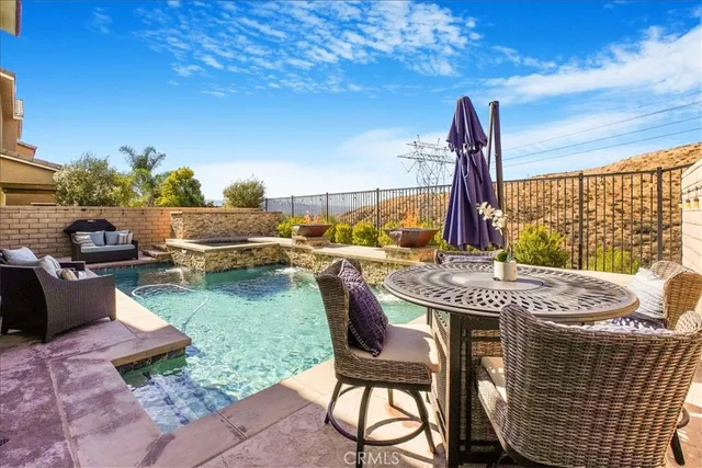 a front view of a house with outdoor seating yard