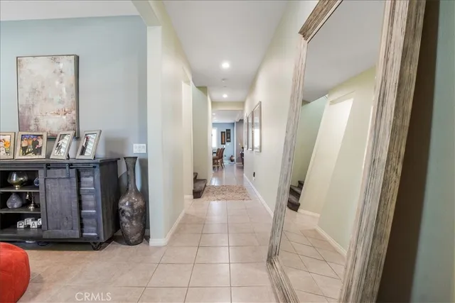 a view of a hallway with seating area