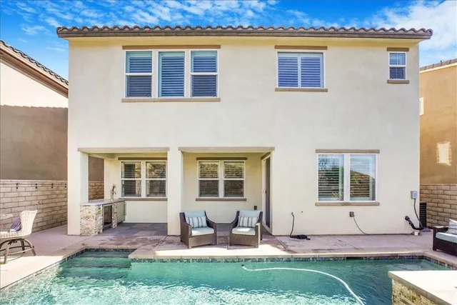 a view of a balcony with chairs
