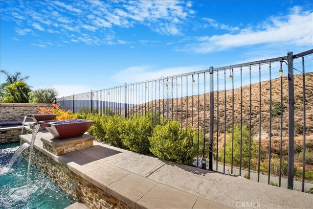 a view of a swimming pool with a lounge chairs