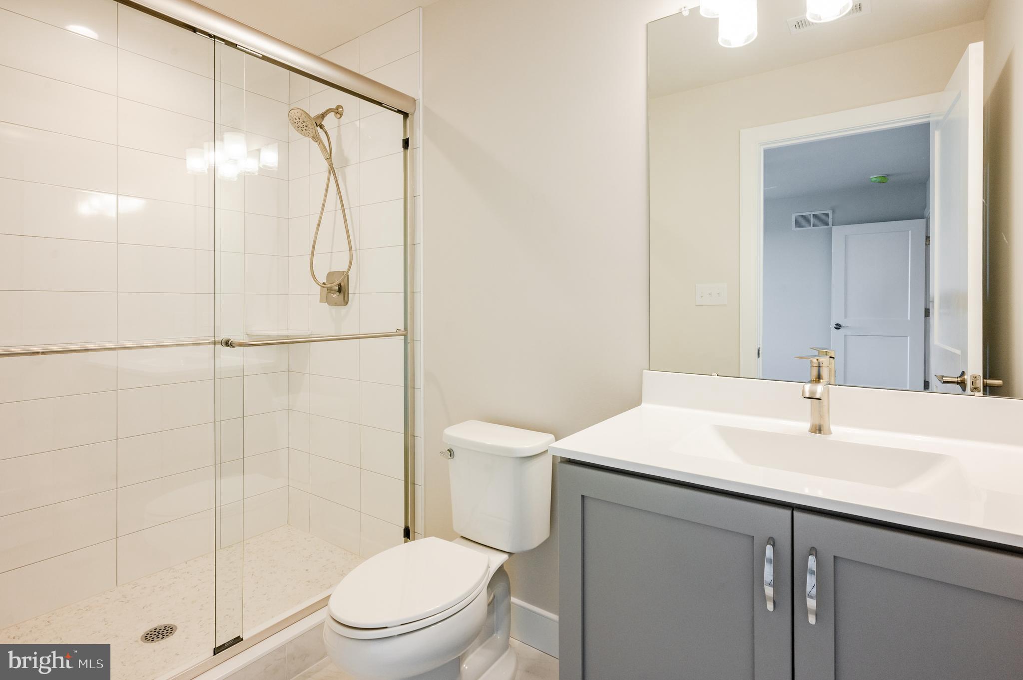 114 Orchard Road Perkasie, PA 18944 - Photo 13 of 17 a bathroom with a sink a toilet and shower