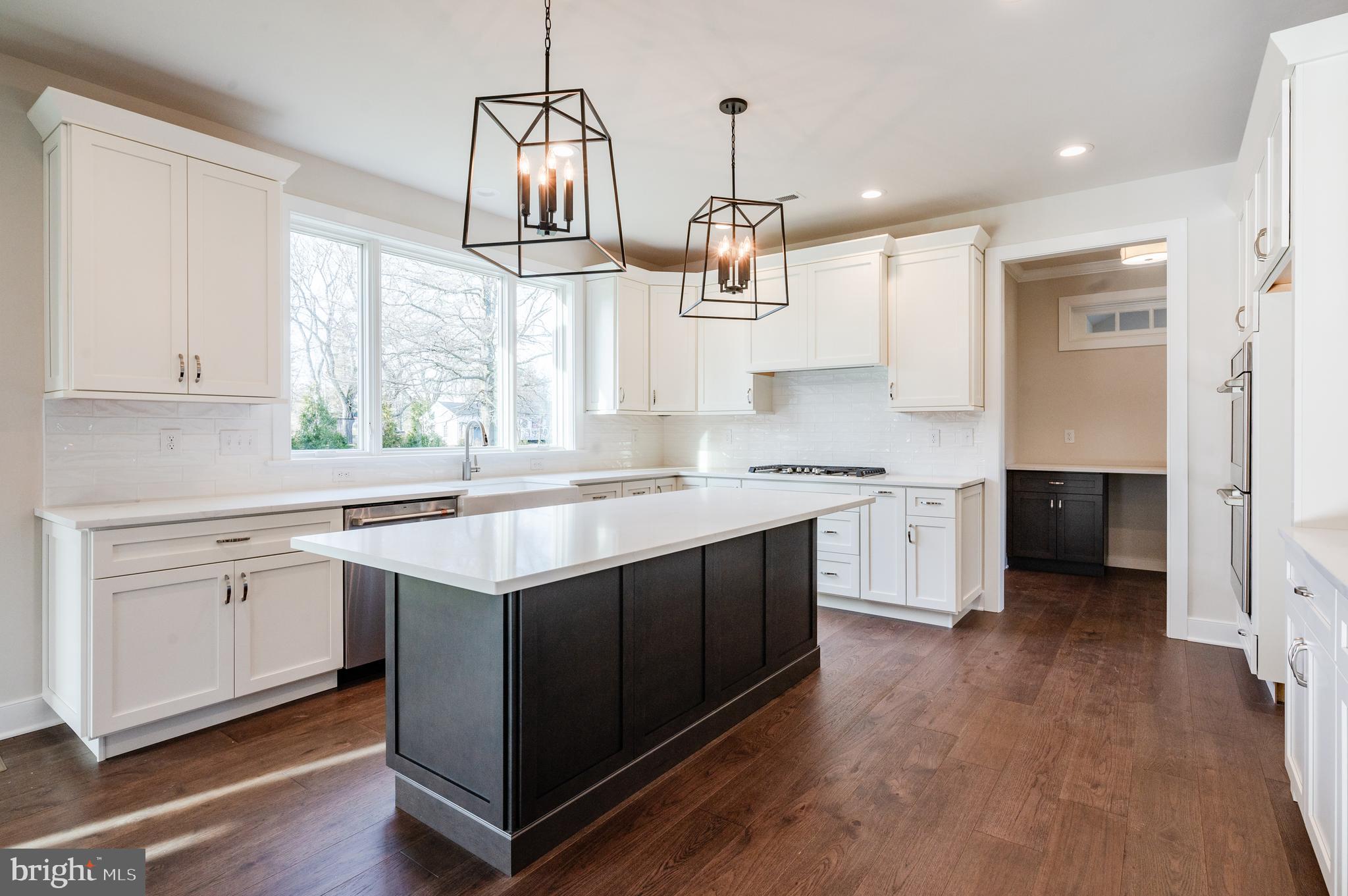 114 Orchard Road Perkasie, PA 18944 - Photo 8 of 17 a kitchen with stainless steel appliances granite countertop a sink stove and refrigerator
